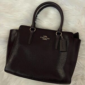 Merlot coach purse.